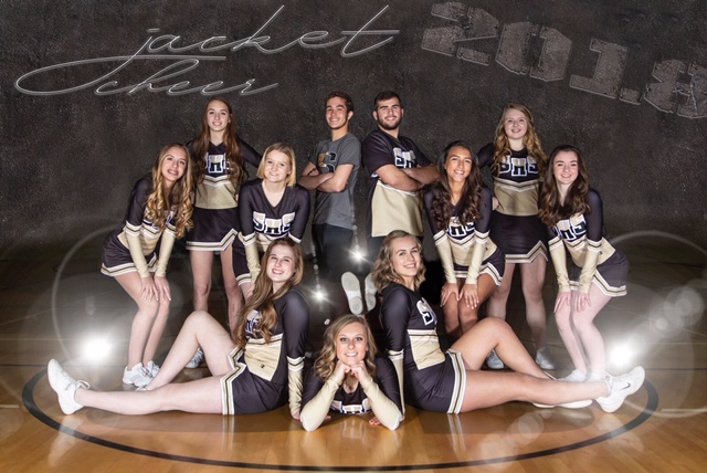 A photo of the 2018/2019 Cheer team combined seated and standing on the High School gymnasium floor