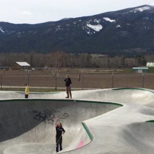 Students clean up the skate park with brooms