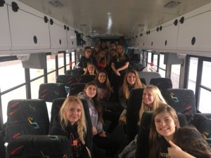 The girls volleyball team on the team bus just before departure to Dillon