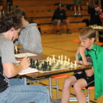 Thomas Walthall plays white against the his opponent who plays black.