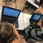 A photo of two students using their new chromeboks